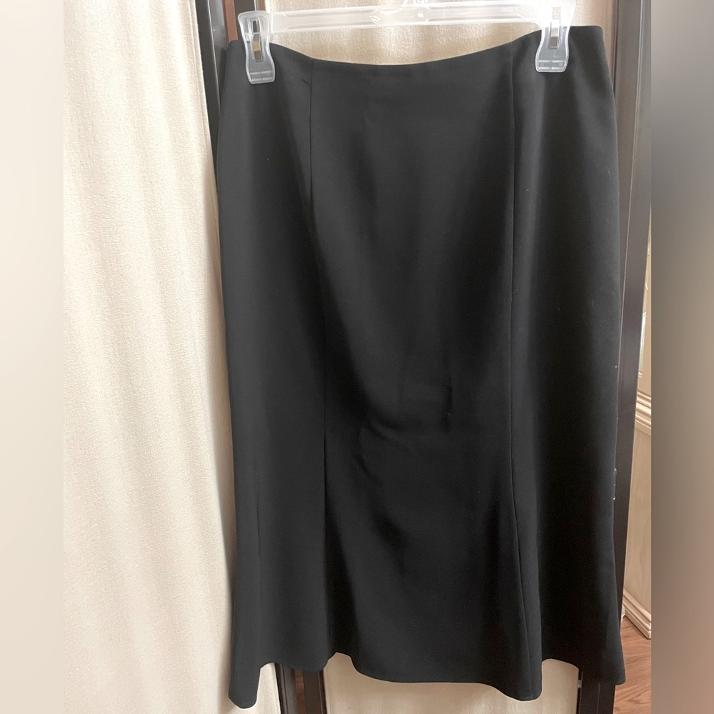 Classic Black Midi Length fully lined Skirt. Hidden zipper on the back side.